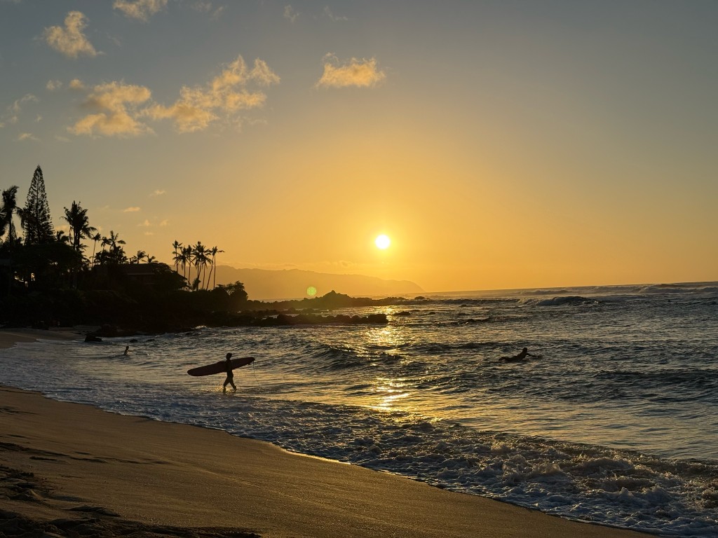 Surfing at sunset